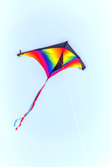Colorful kite flying on sky