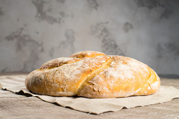 delicious baked good on a light textile background, capital bun