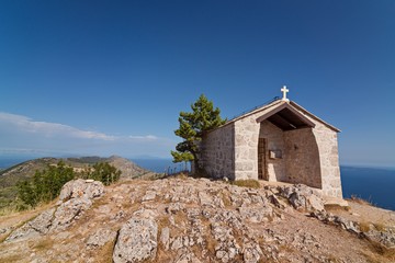 Fototapeta na wymiar Old stone chapel on the top of sveti Nikola mount.