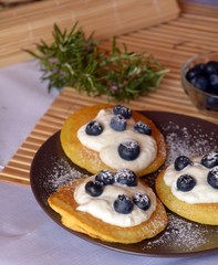 Fresh homemade pancakes with blueberries and cottage cheese.