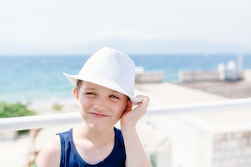 Little boy child in white hat