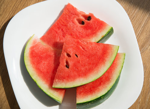 watermelon slices shot top down on plate