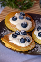 Fresh homemade pancakes with blueberries and cottage cheese.