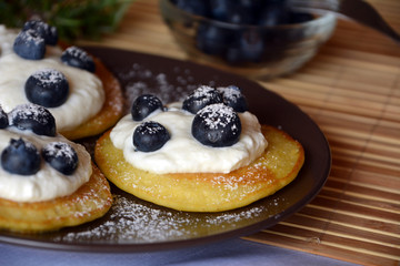 Fresh homemade pancakes with blueberries and cottage cheese.