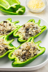 Uncooked mediterranean stuffed pepper in baking dish. 