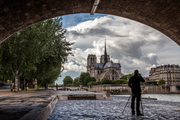 A Photographer in Paris Photographing Notre Dame and the Seine