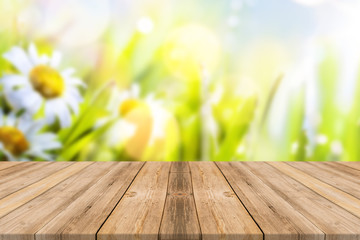 Wooden table with flower background 