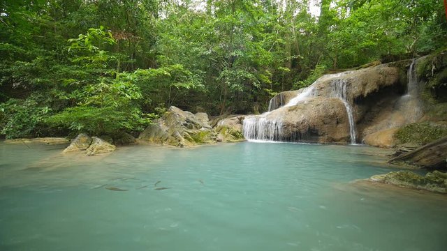 Slow motion of Level 1 of Erawan Waterfall with Neolissochilus stracheyi fish in Kanchanaburi Province, Thailand