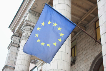 Flag of European Union against the facade of  building