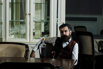 Man relaxing with wine in restaurant