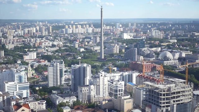 Beautiful panorama of the city with trees and buildings from a bird's-eye view. SLOW MOTION. HD, 1920x1080.
