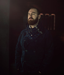 Handsome bearded man hipster with stylish beard.