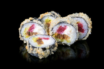 Japanese rolls on black background
