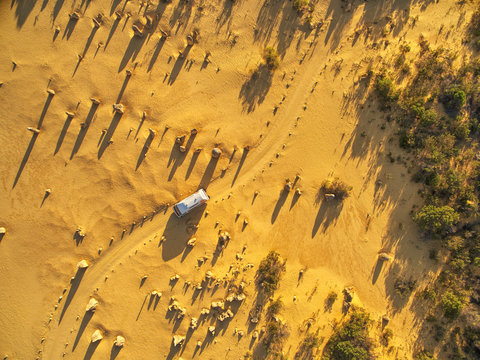 Aerial view of camper van driving through desert in Western Australia
