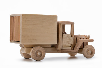 Truck van car toy made of natural wood, side view.