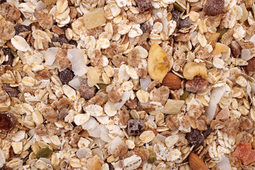 Background of muesli - cereal with seeds, fruit and nuts