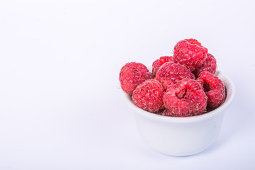 Fresh raspberry in a cup