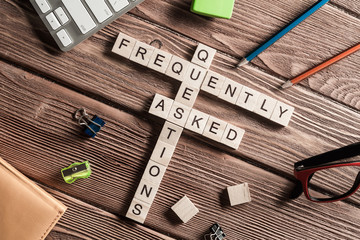 Conceptual media keywords on table with elements of game making crossword