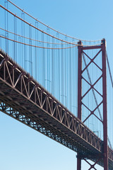 Lisbon - Detail of the 25th april bridge against blue sky