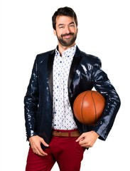 Man with jacket holding a basket ball