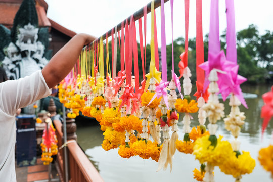 Marigold garlands holding on .steel at the temple