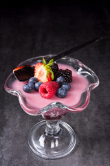 delicious pudding with wild berry