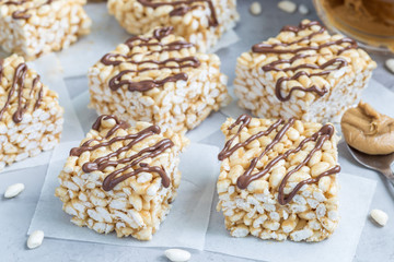 Homemade three ingredients bars: crispy rice, honey and peanut butter, horizontal