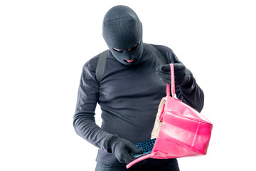 Robber pulls out a purse from a female bag on a white background