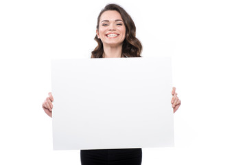 attractive smiling young woman with blank banner, isolated on white