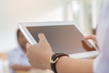 student testing in exercise, exams answer on a tablet computer in elementary, high school lesson in class room for test exams online education by finger clicking