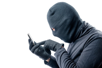 Portrait of a hacker with a stolen mobile phone on a white background