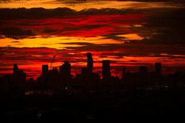 Fototapeta na wymiar On Sunset and twilight sky, Silhouette image of metropolises.