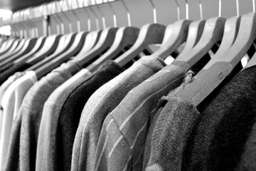 Obraz premium Dresses of wool and cotton hanging in a row
