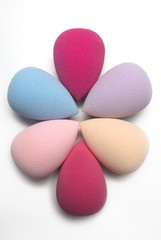 Set of cosmetic beauty blenders on a white background