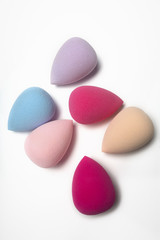 Kit of cosmetic beauty sponges on a white background