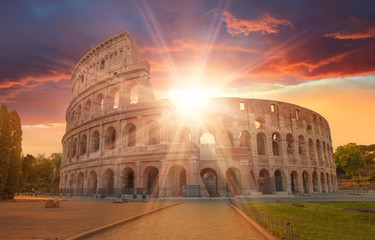Fototapeta na wymiar View of Colosseum in Rome and morning sun, Italy, Europe.