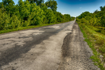 Background texture landscape old road highway with holes in the summer of HDR