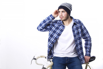 Man hipster sitting on the bicycle