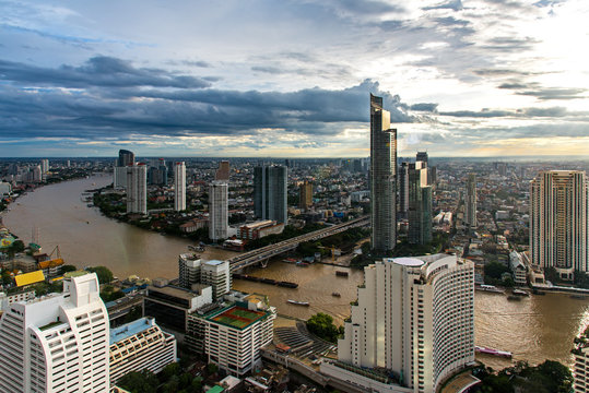 Aerial view over Bangkok modern office building in bangkok business zone near the river with sunset sky in Bangkok, Thailand