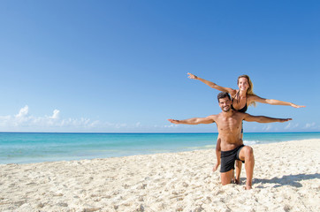 Couple playing at the beach