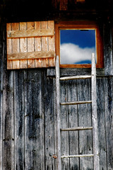 a ladder to the window clouds and blue sky