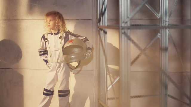 Young blond girl astronaut