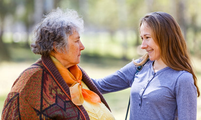 Happy elderly woman with her daughter