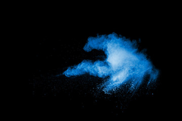 Fototapeta na wymiar Launched blue powder, isolated on black background