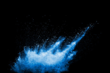 Launched blue  powder, isolated on black background