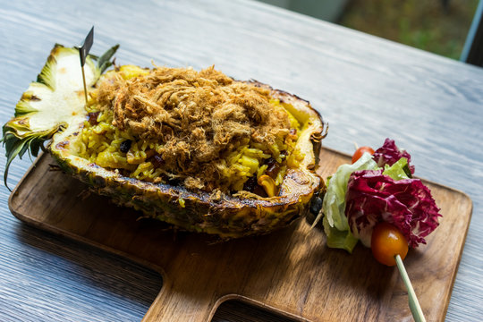 Fried rice in pineapple on table, Selective focus.