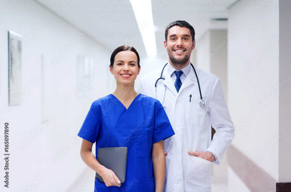 Canvas Prints smiling doctor in white coat and nurse at hospital