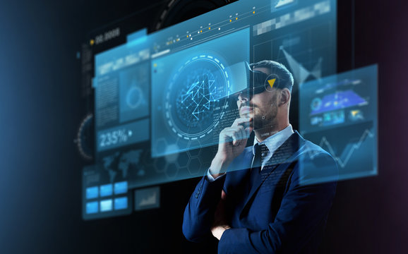 businessman in virtual reality headset and screens
