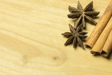 High angle view anise and cinnamon sticks on wooden table