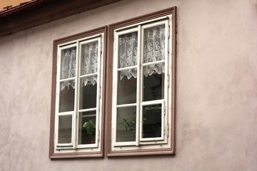 Two small windows with curtains